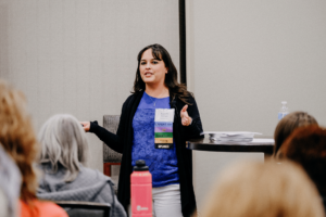 Jeanette speaking at conference