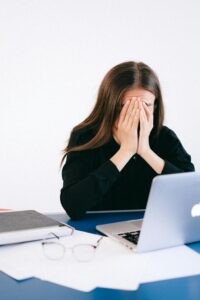 Sad woman looking at computer